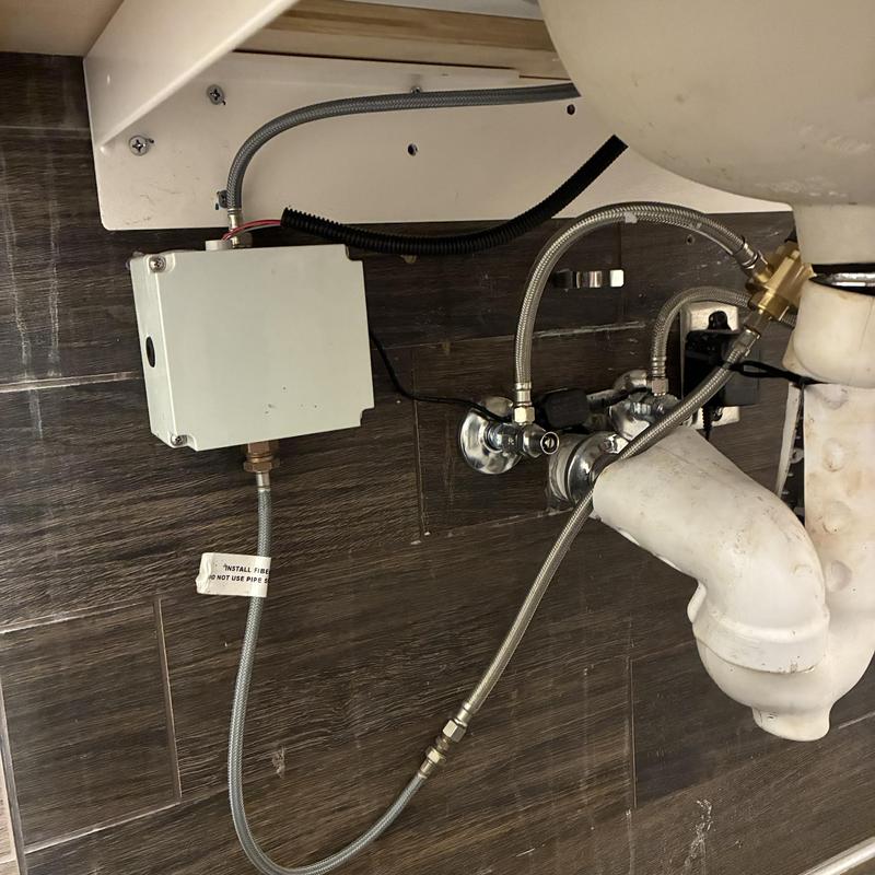 Mixing valve under lavatory sink with plumbing connections