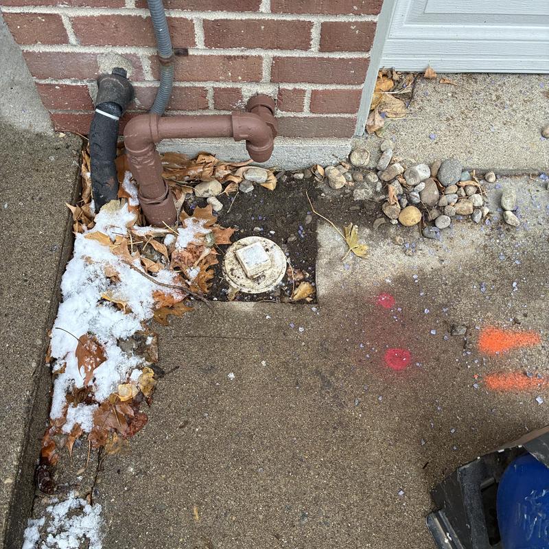 Sewer line inspection access with pipes and debris