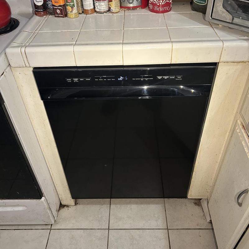 Dishwasher installation in kitchen cabinetry space