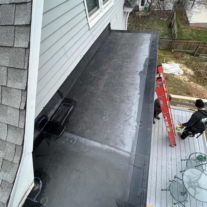 EPDM roofing installation on flat porch roof EPDM roofing installation on flat porch roof