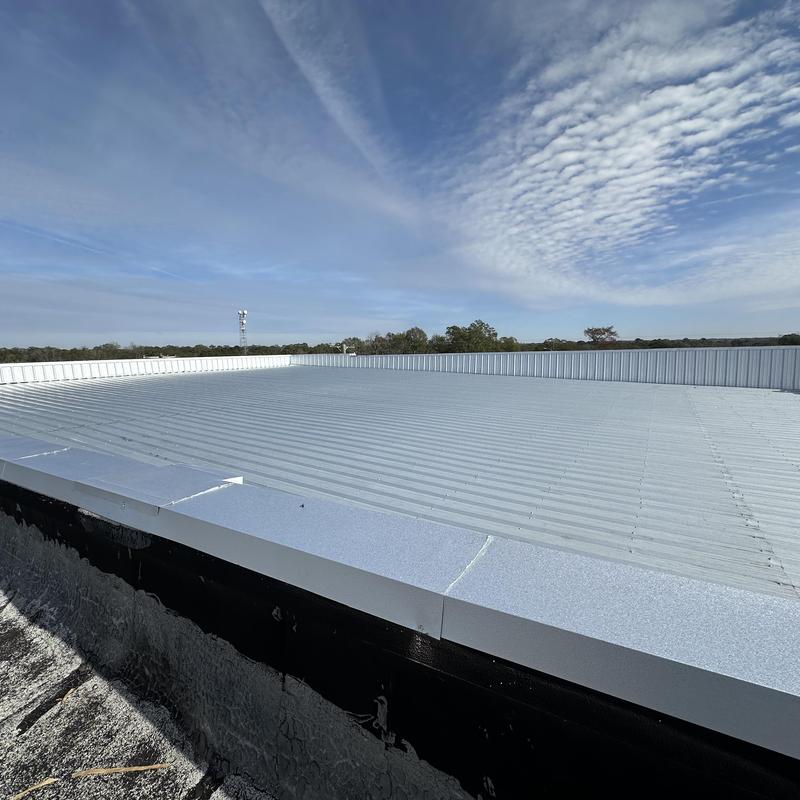 Metal roof with sealed wall panels and flashing Metal roof with sealed wall panels and flashing