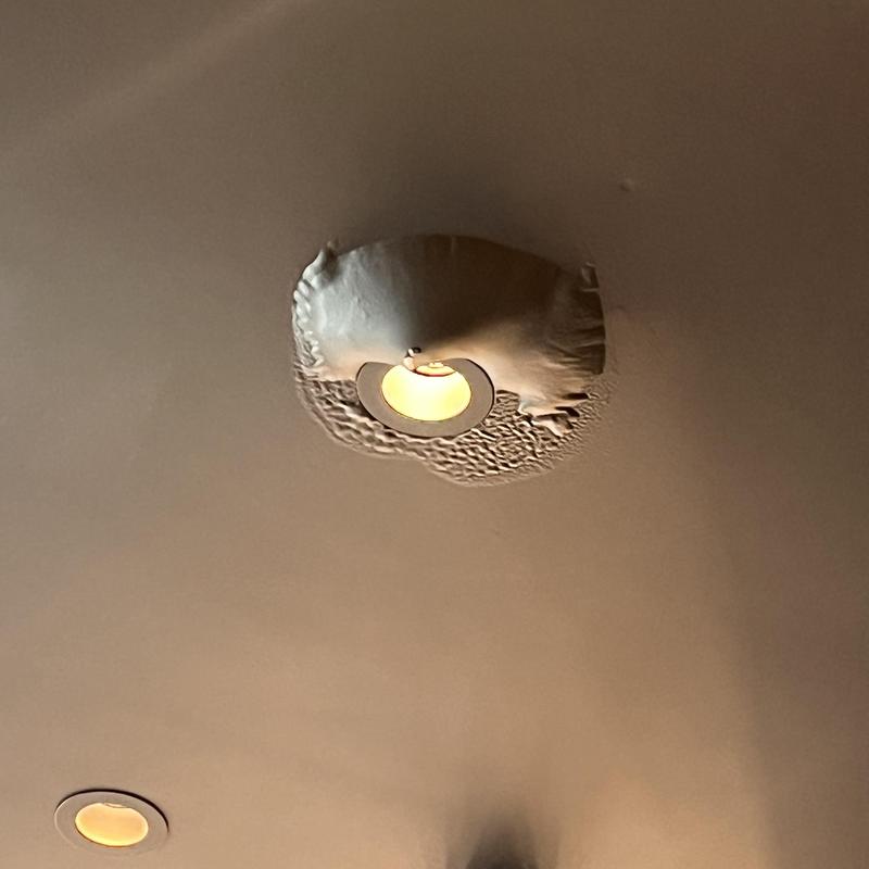 Ceiling drywall water damage around recessed light fixture Ceiling drywall water damage around recessed light fixture
