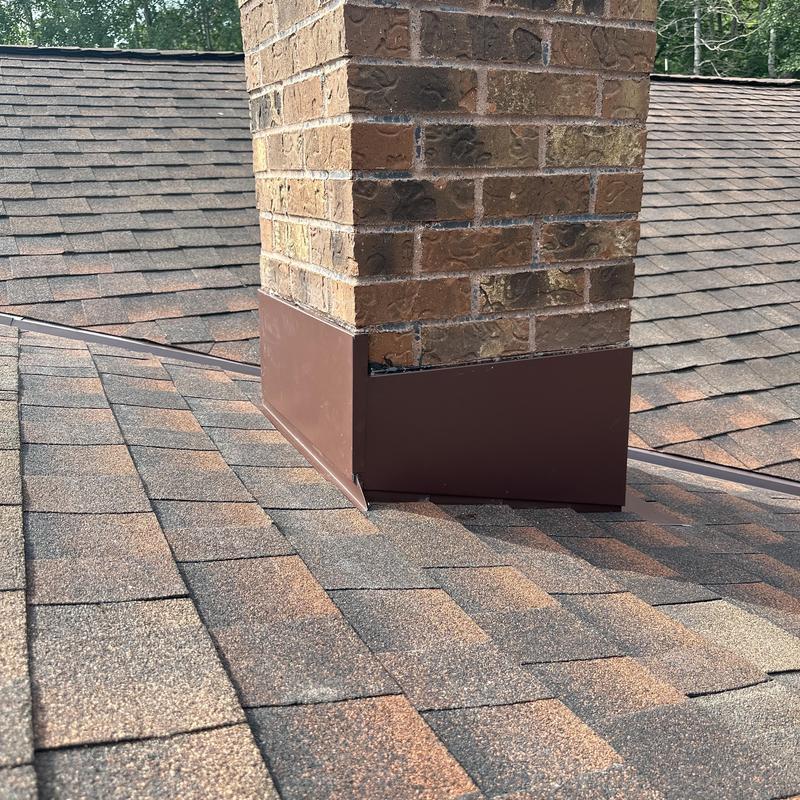 Chimney flashing with new metal and shingles Chimney flashing with new metal and shingles