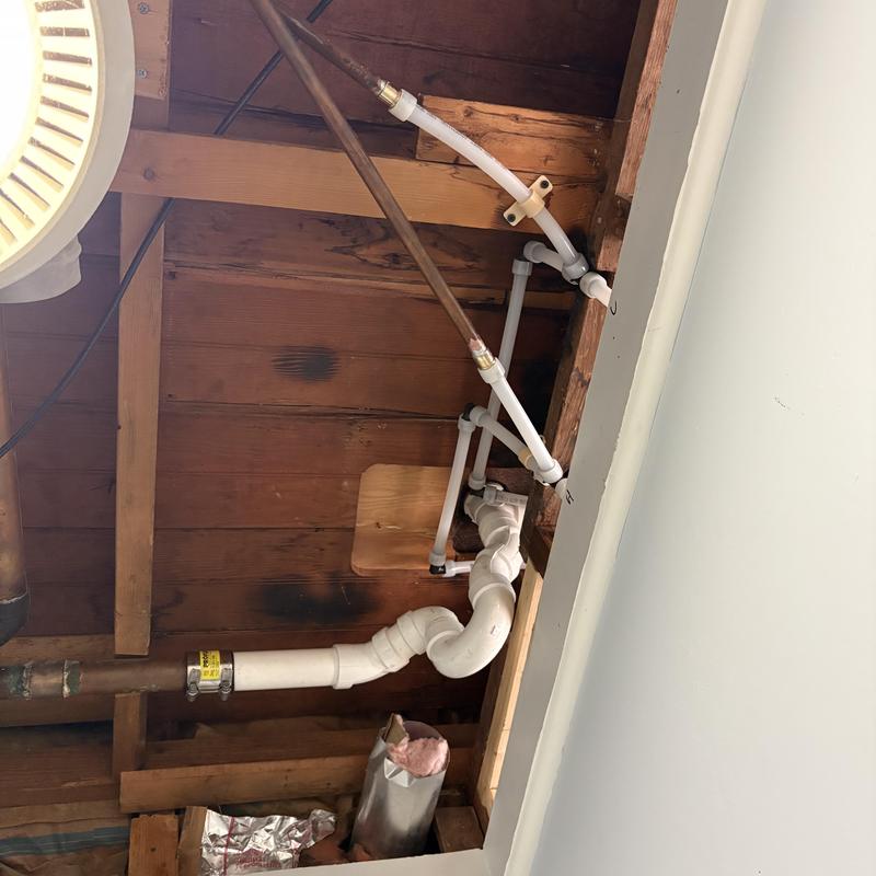 Second-floor tub drain rerouted with PEX piping