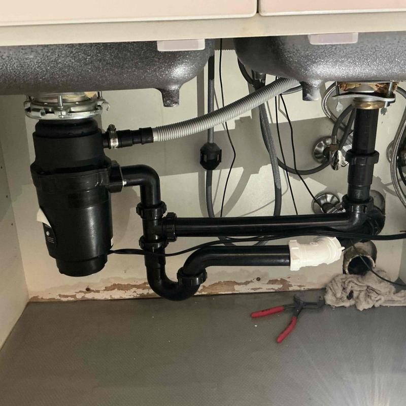 Kitchen sink drain pipes with disposal unit under cabinet