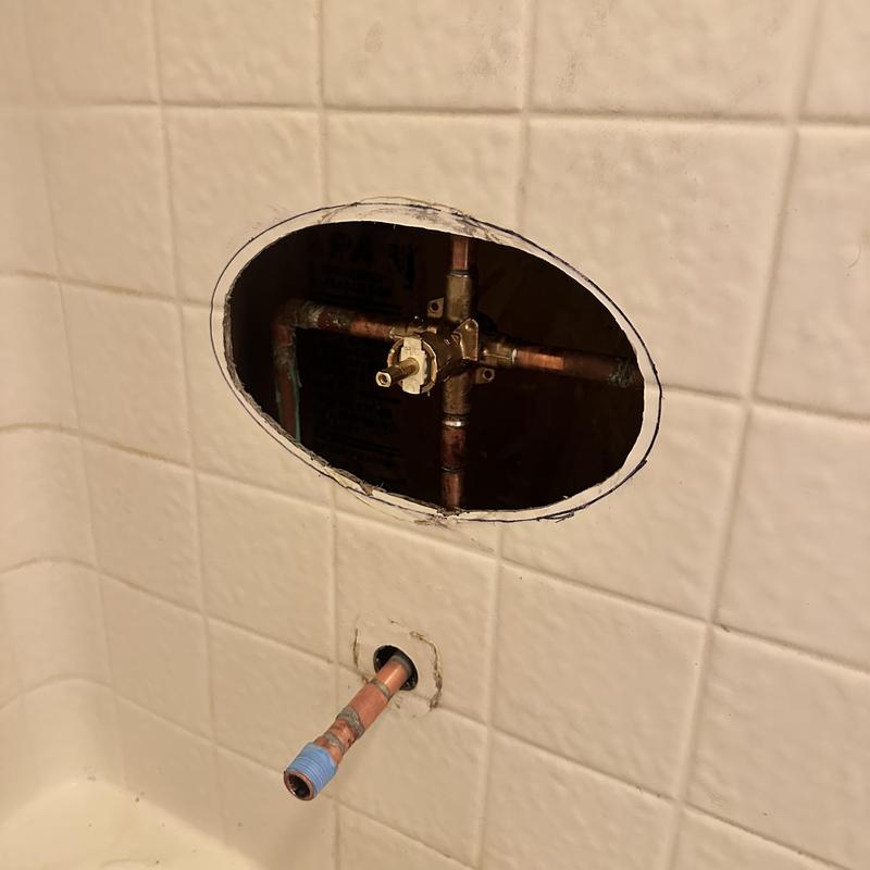 Moen shower valve with exposed copper piping in tub wall