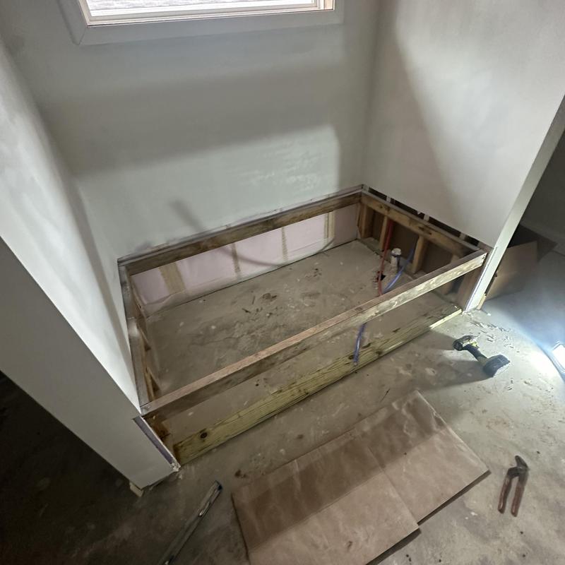 Soaker bathtub frame installation with plumbing rough-in Soaker bathtub frame installation with plumbing rough-in