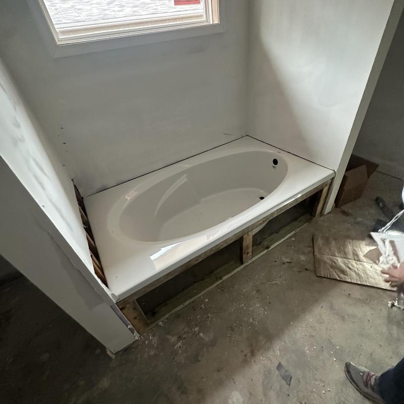 Soaker bathtub installation in unfinished bathroom space Soaker bathtub installation in unfinished bathroom space