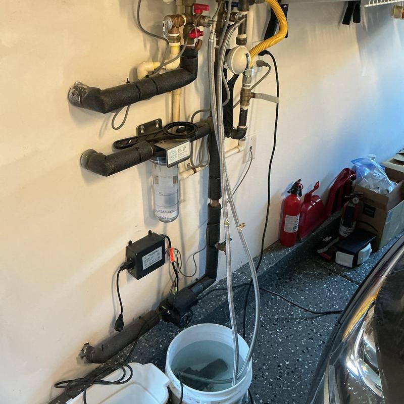 Tankless water heater pre filter and descaling setup