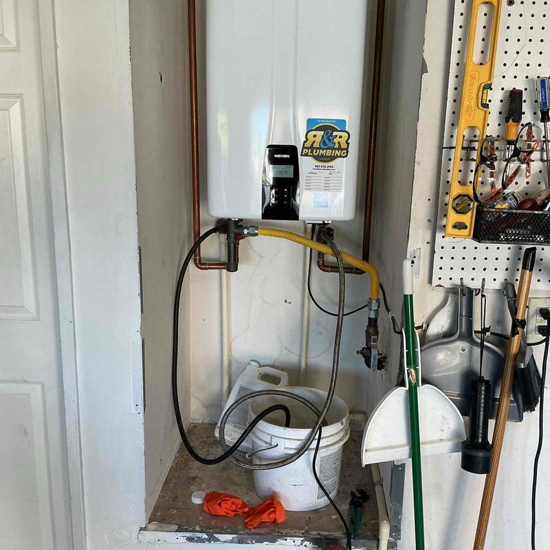 Tankless water heater flushing setup with bucket
