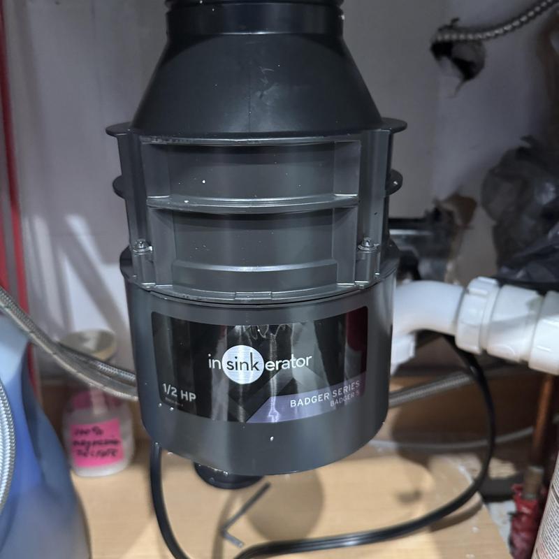 Garbage disposal unit installation under bar sink