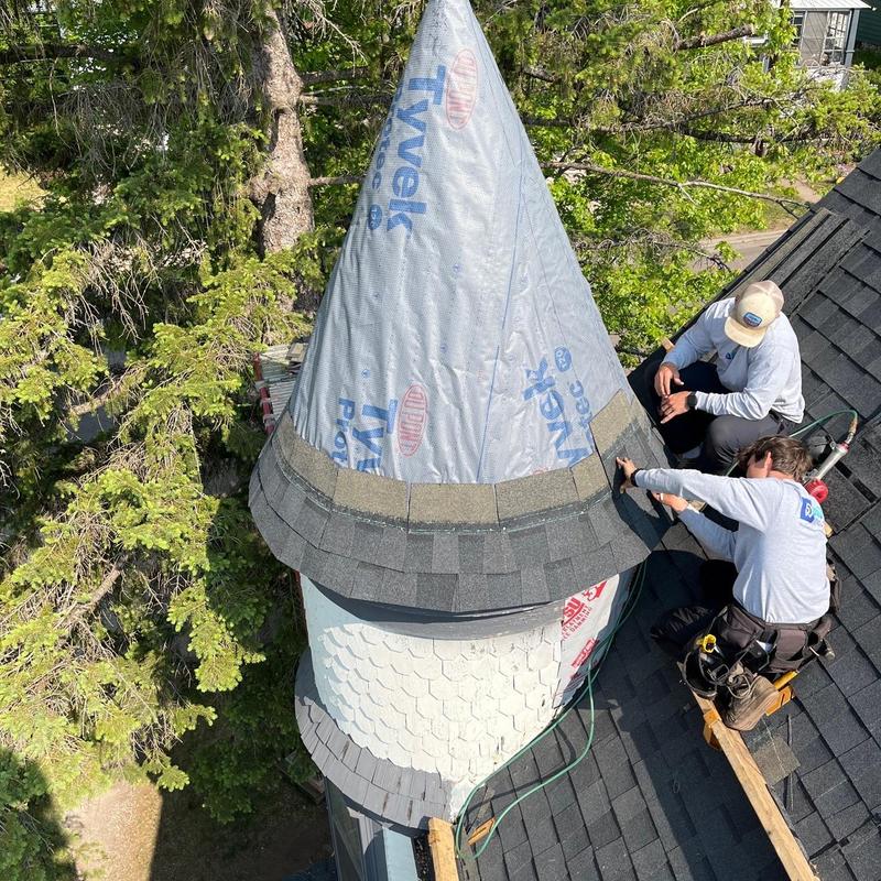 Turret roof shingles installation on residential home Turret roof shingles installation on residential home