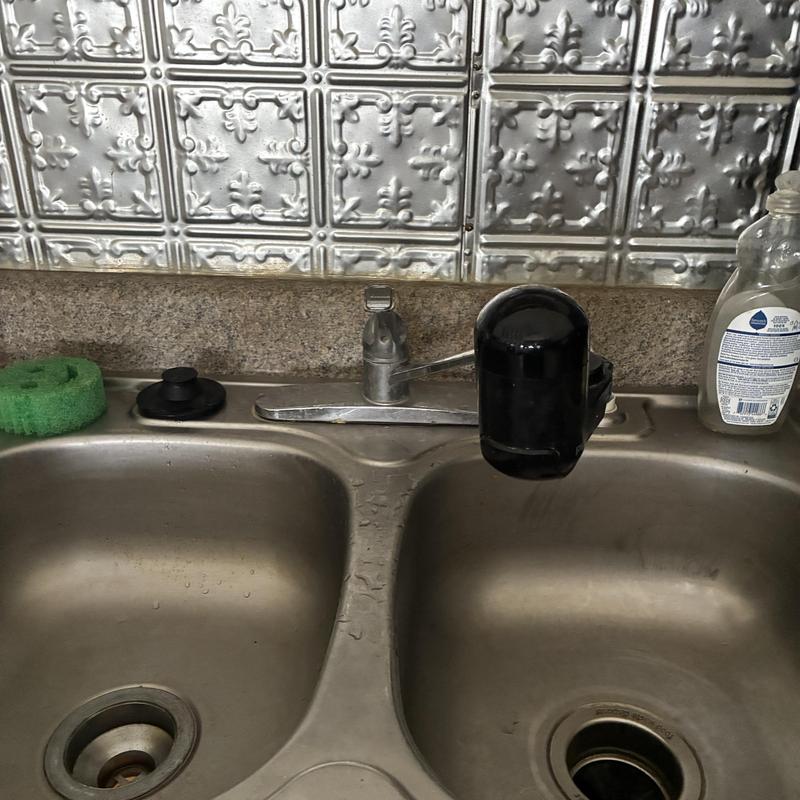 Kitchen sink drain with faucet and soap bottle