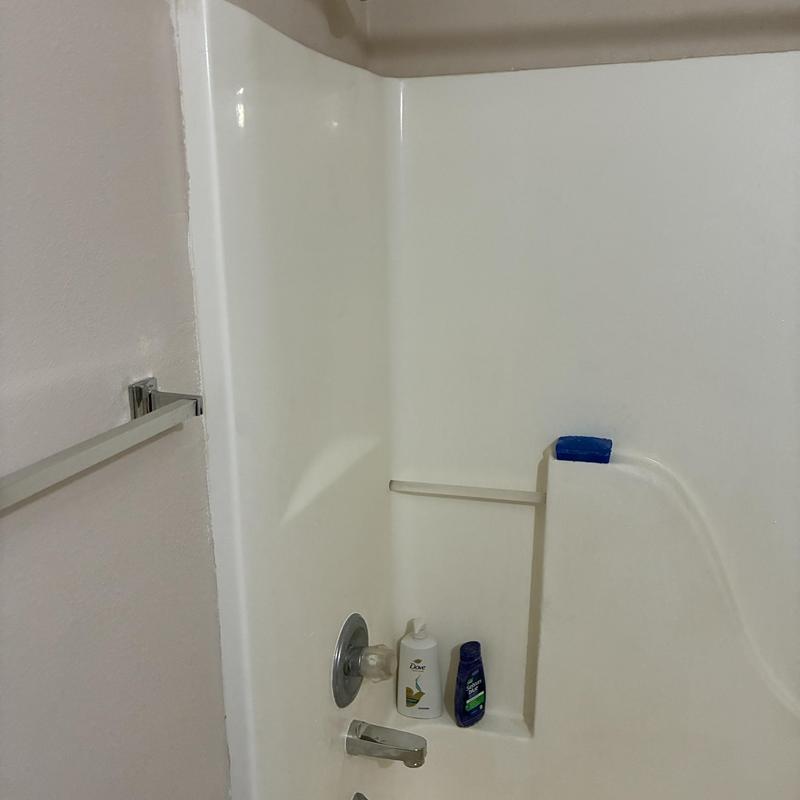 Shower head and tub spout in second-floor bathroom