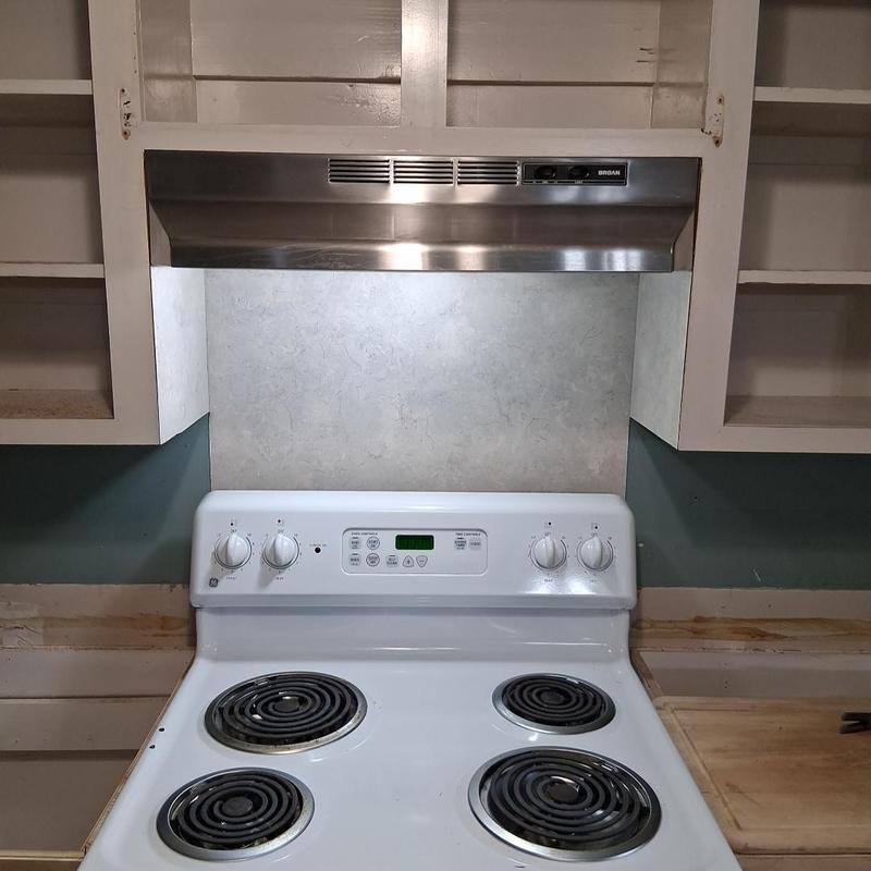 Stainless steel vent hood installation over electric stove Stainless steel vent hood installation over electric stove