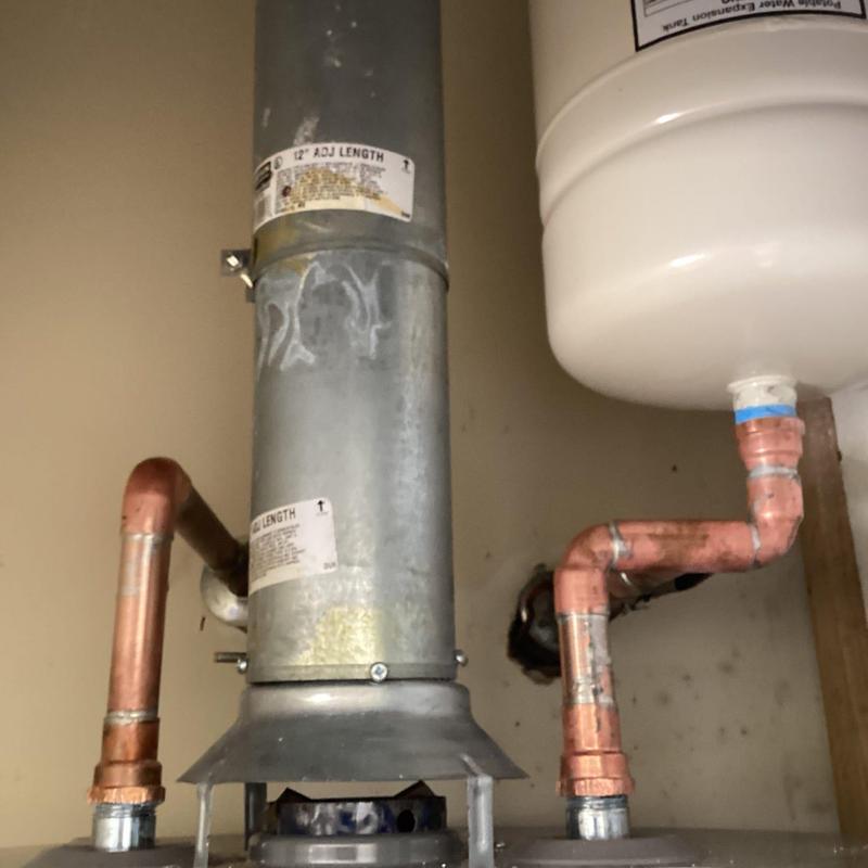 Copper piping connected to water heater expansion tank