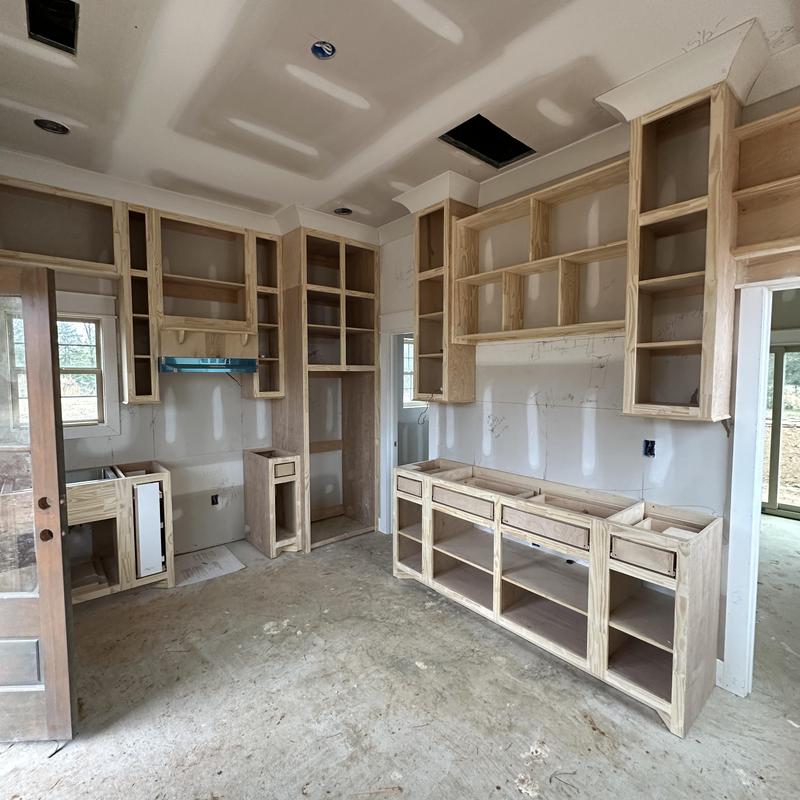 Custom wooden kitchen cabinets in tiny house interior Custom wooden kitchen cabinets in tiny house interior