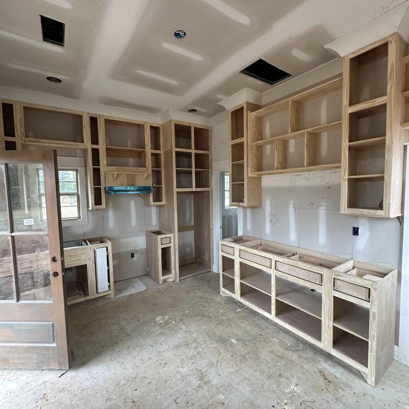 Custom wooden kitchen cabinets under construction in tiny house Custom wooden kitchen cabinets under construction in tiny house