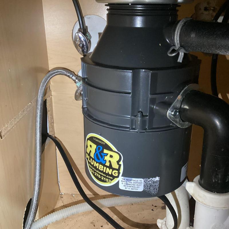 Garbage disposal installation with plumbing connections