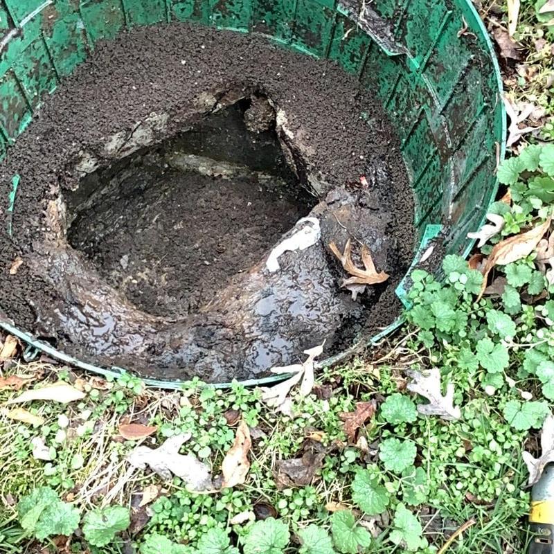 Septic tank inlet pipe clogged with sludge and debris