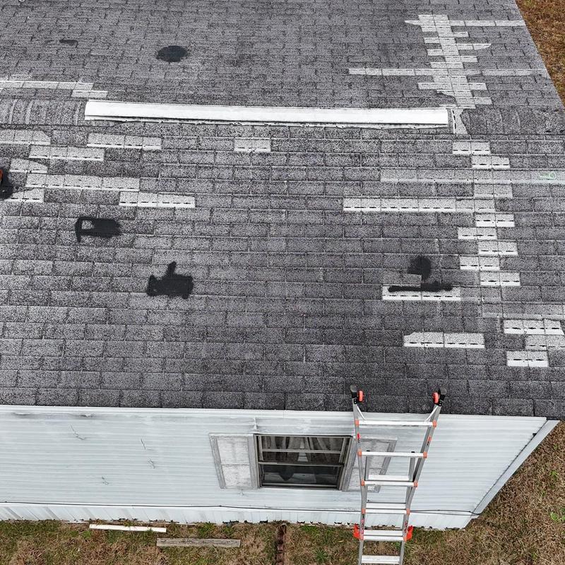 Asphalt shingle roof measurement with ladder onsite