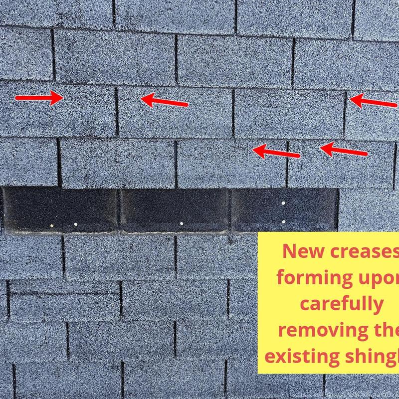Asphalt roof shingles with new creases forming