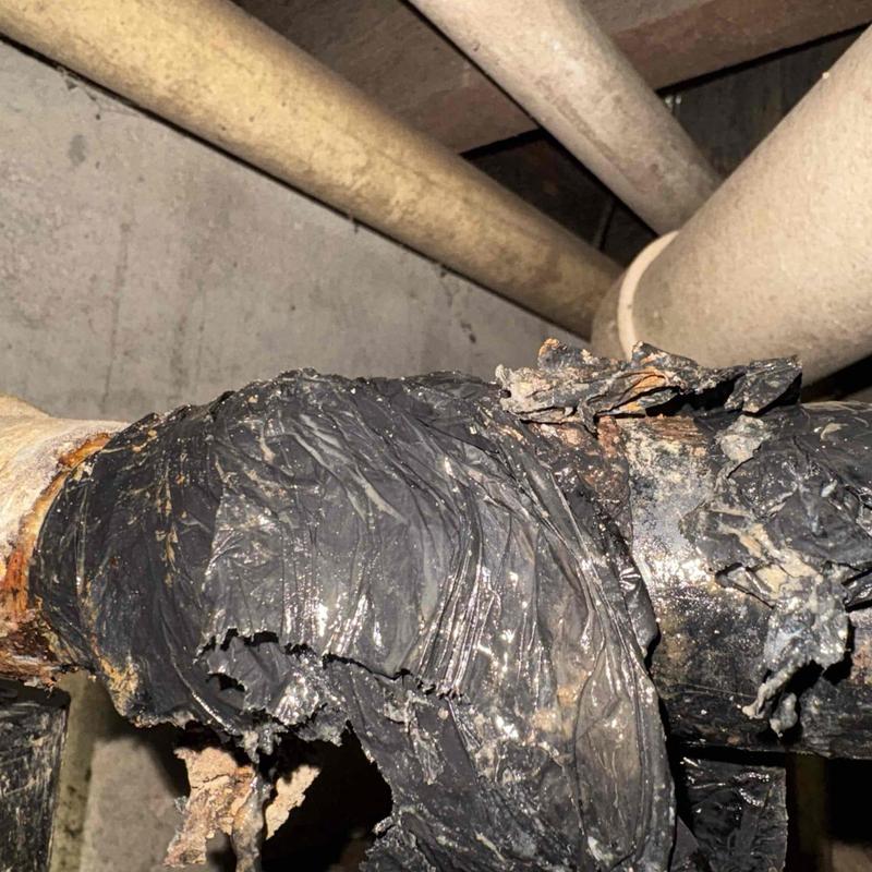 Kitchen sink drain line with damaged pipe wrap