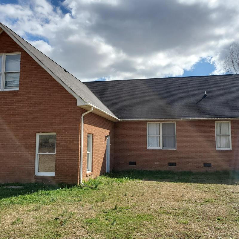 Asphalt shingle roof with wind damage in Lexington SC