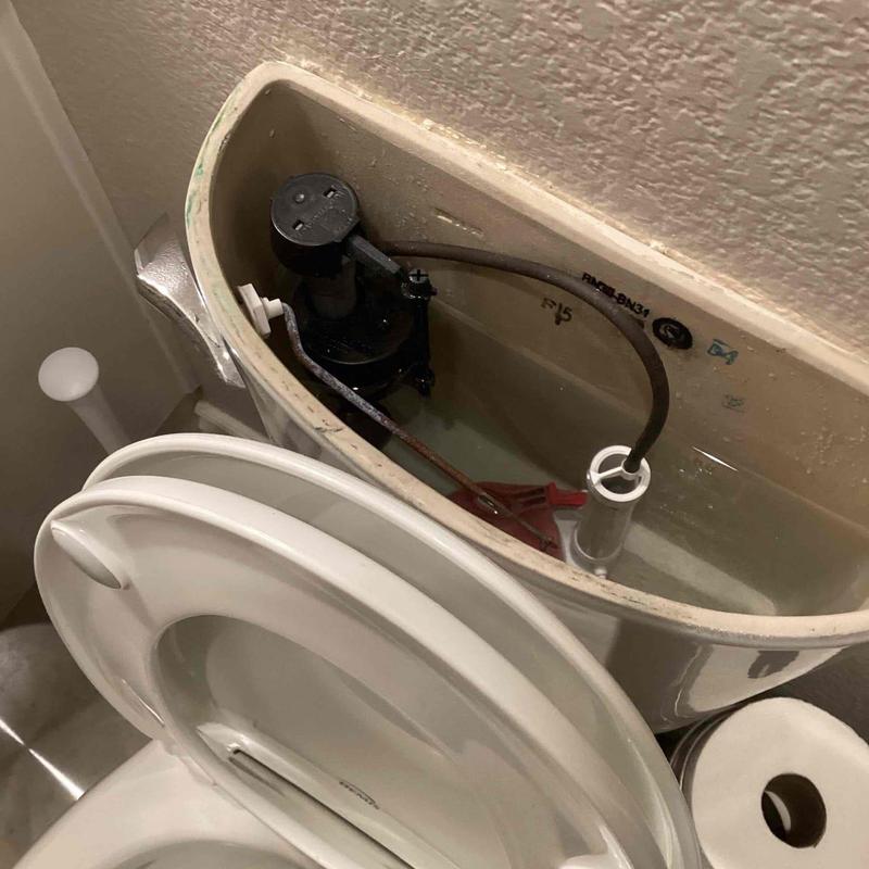 Toilet fill valve and flush mechanism inside tank