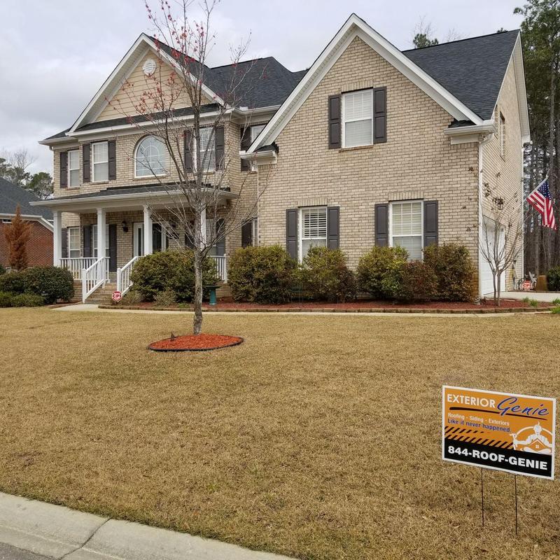 Multi-gable roof with new asphalt shingles installed