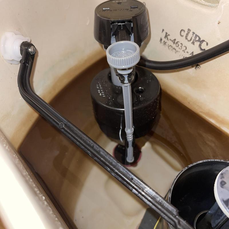 Toilet universal fill valve installed inside tank