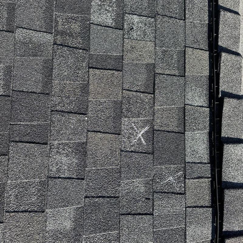 GAF lifetime asphalt roof with marked repair spots