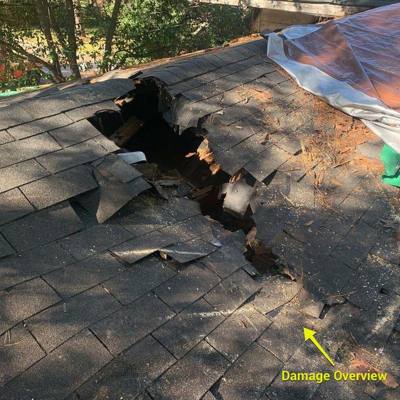 Roof shingles and rafters with large hole damage Roof shingles and rafters with large hole damage
