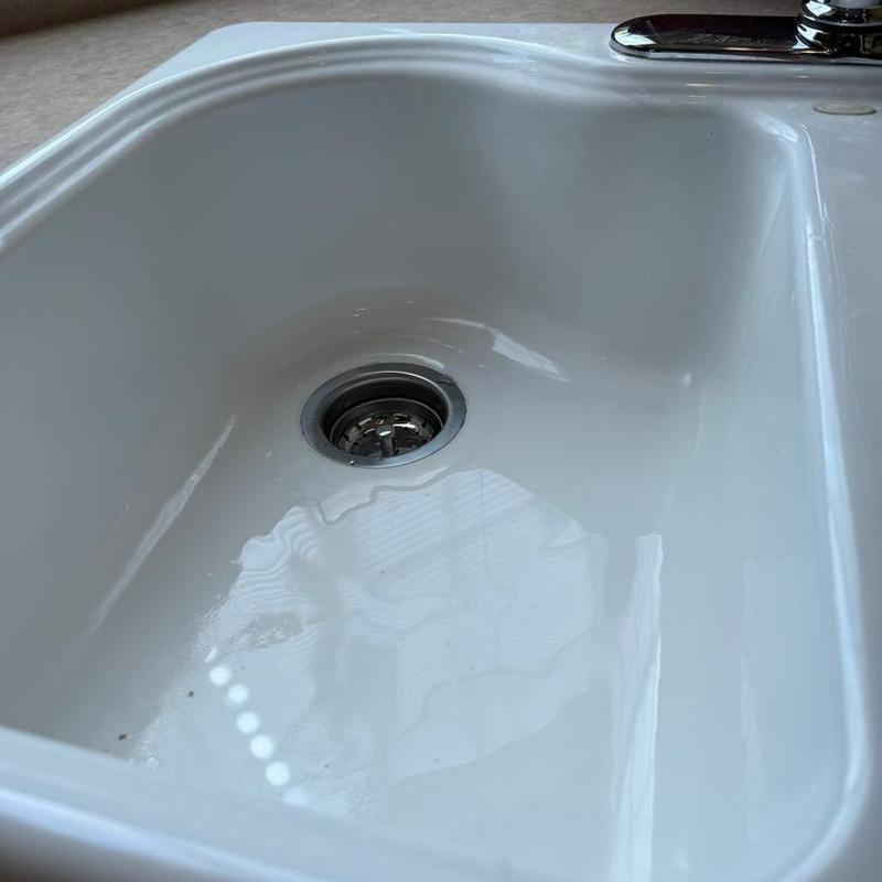 Kitchen sink drain with stopper installed Kitchen sink drain with stopper installed