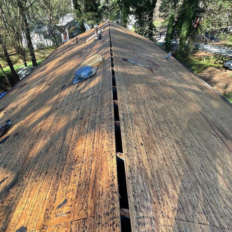 Roof plywood decking with exposed gap on ridge line Roof plywood decking with exposed gap on ridge line