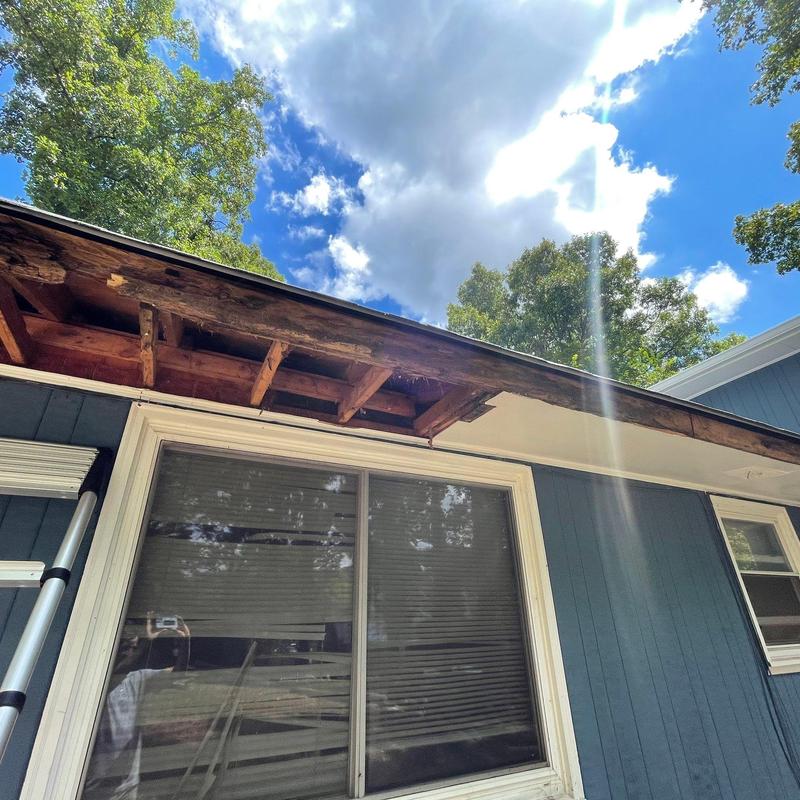 Roof decking with broken rafters exposed for repair Roof decking with broken rafters exposed for repair
