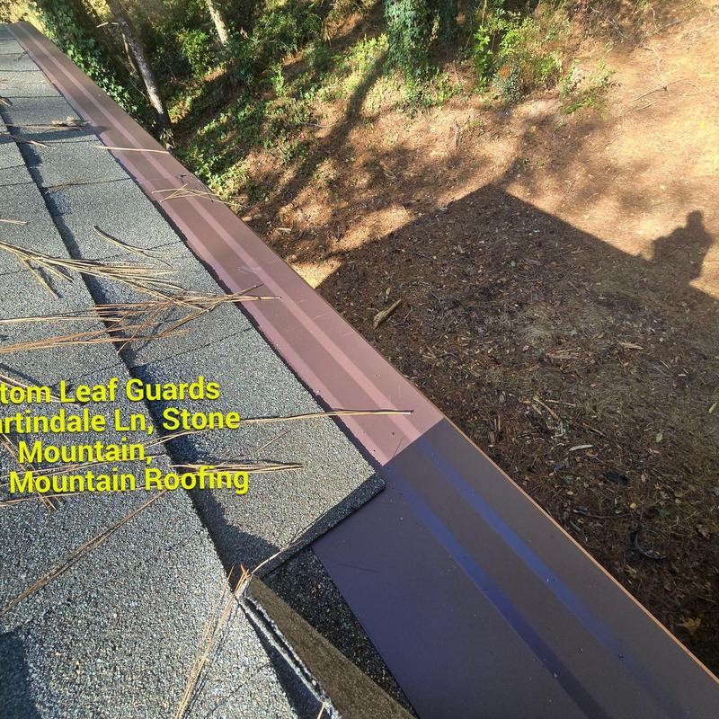 Seamless gutters with leaf guards on shingle roof Seamless gutters with leaf guards on shingle roof