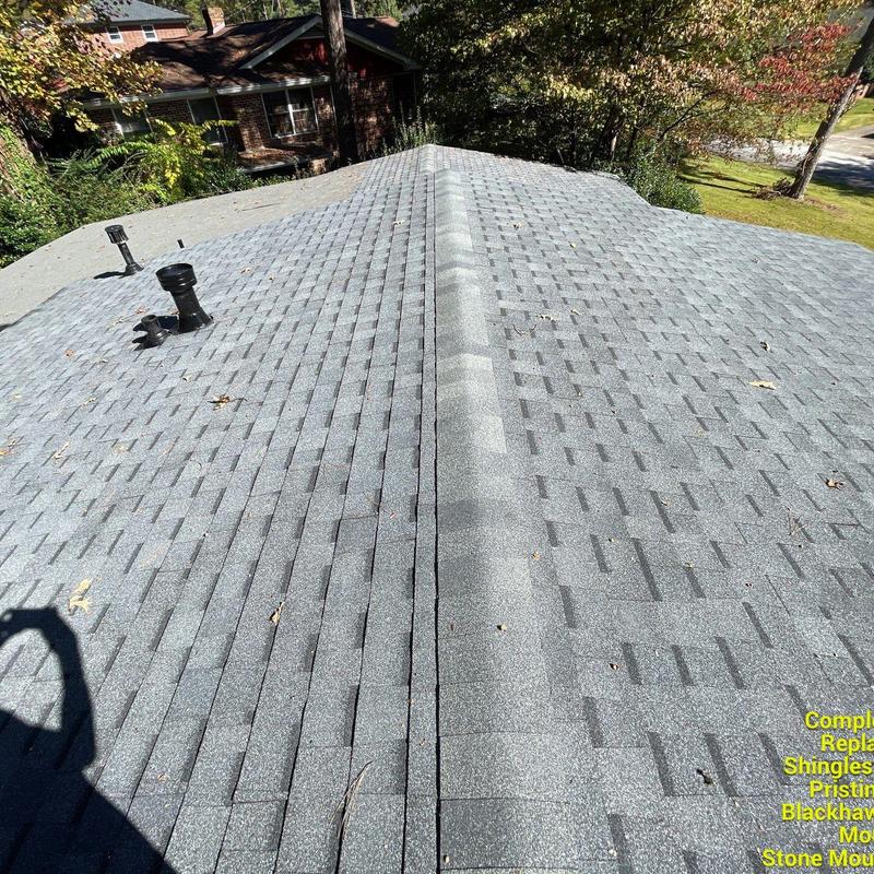 Atlas Pristine Lifetime Pewter shingles on residential roof Atlas Pristine Lifetime Pewter shingles on residential roof