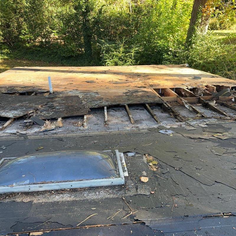 Skylight and roof deck with water damage and decay Skylight and roof deck with water damage and decay