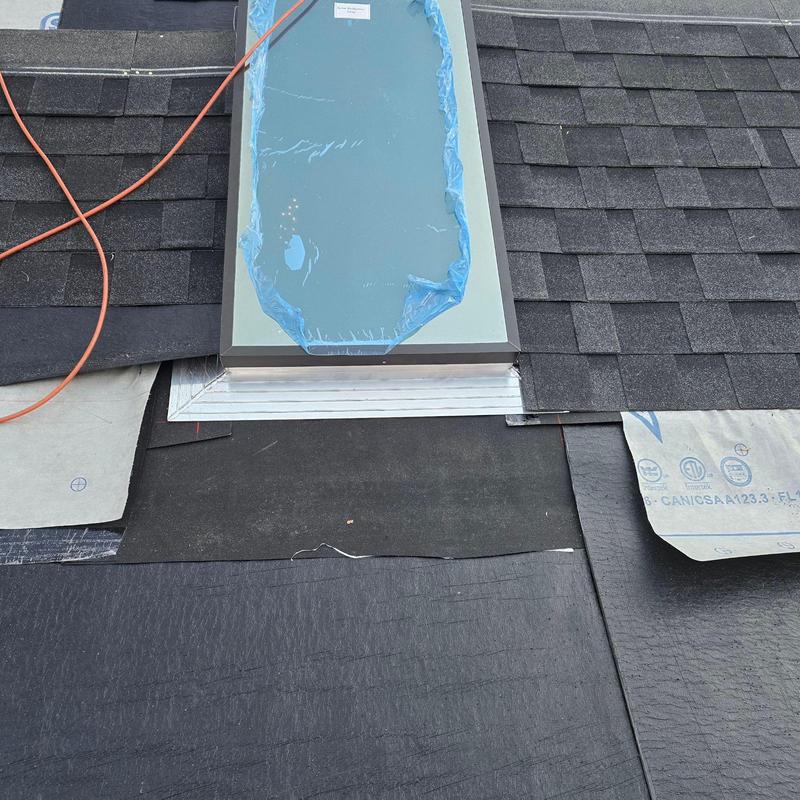 Commercial skylight with flashing and shingle roof installation Commercial skylight with flashing and shingle roof installation
