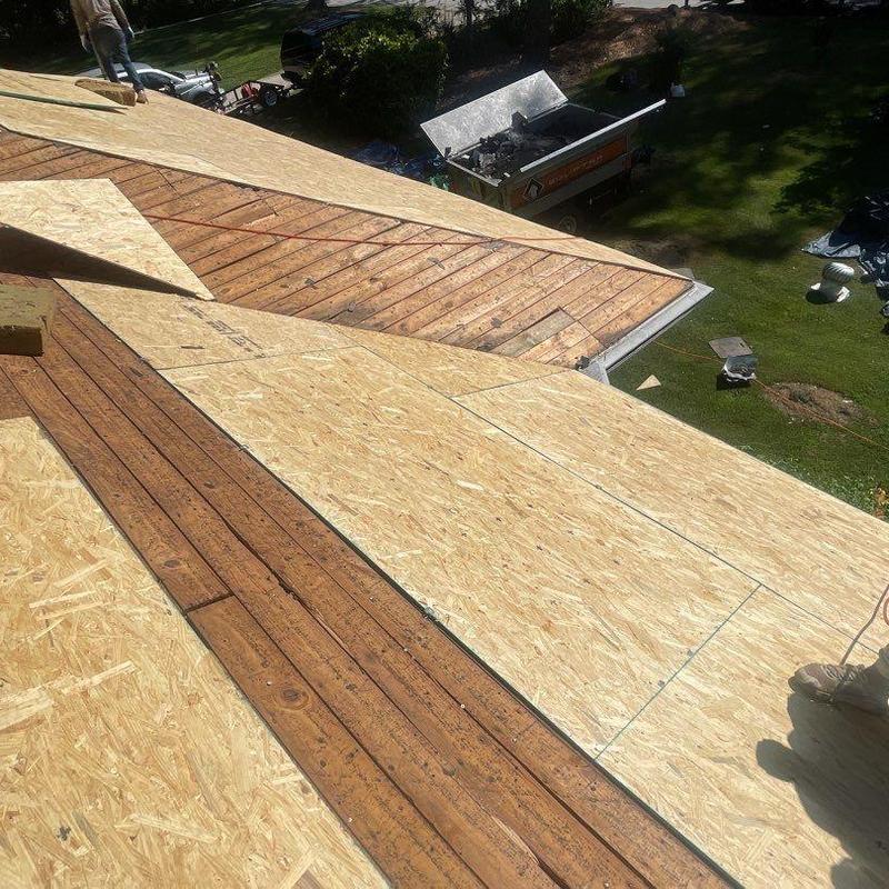 OSB roof sheathing installation on residential roof OSB roof sheathing installation on residential roof