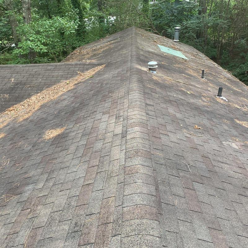 Asphalt shingle roof with ridge vents and plumbing vents Asphalt shingle roof with ridge vents and plumbing vents