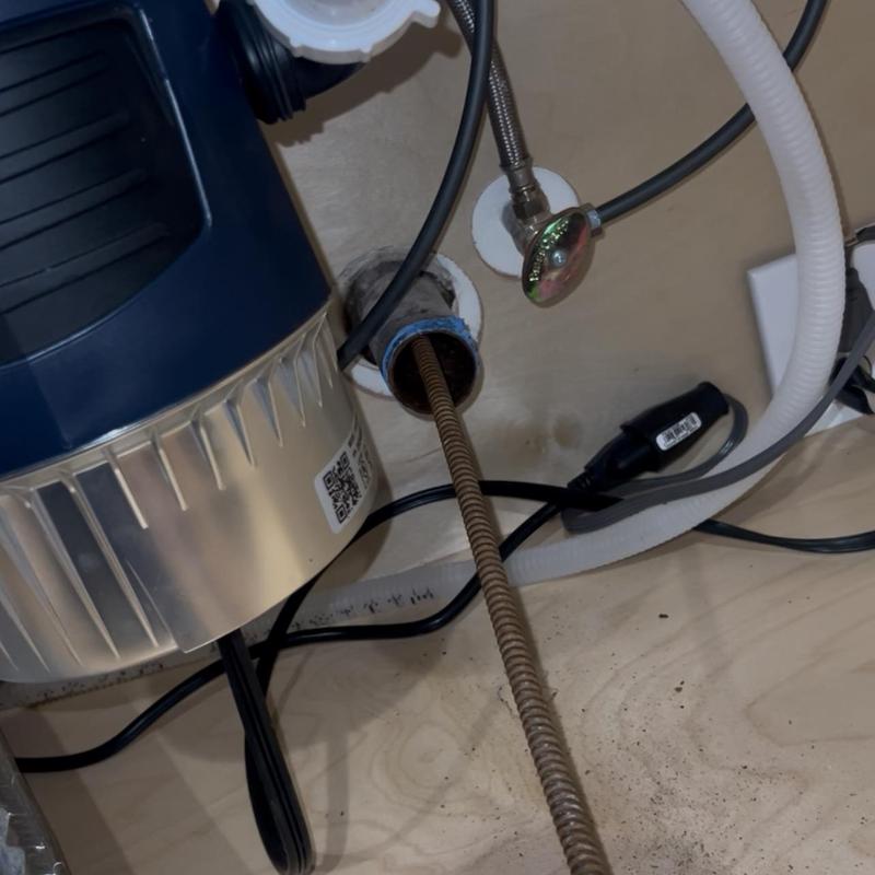 Kitchen drain snake cleaning under sink in Stockton