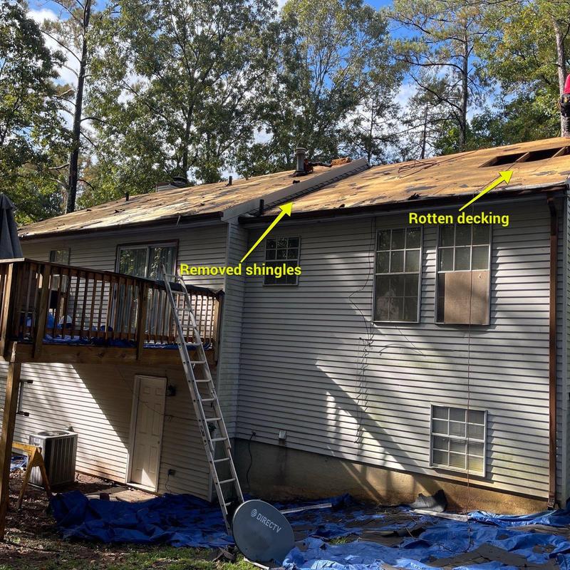 Roof decking with removed shingles and rotten areas Roof decking with removed shingles and rotten areas