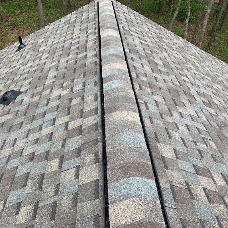 Atlas Pristine Lifetime shingles installed on roof ridge Atlas Pristine Lifetime shingles installed on roof ridge