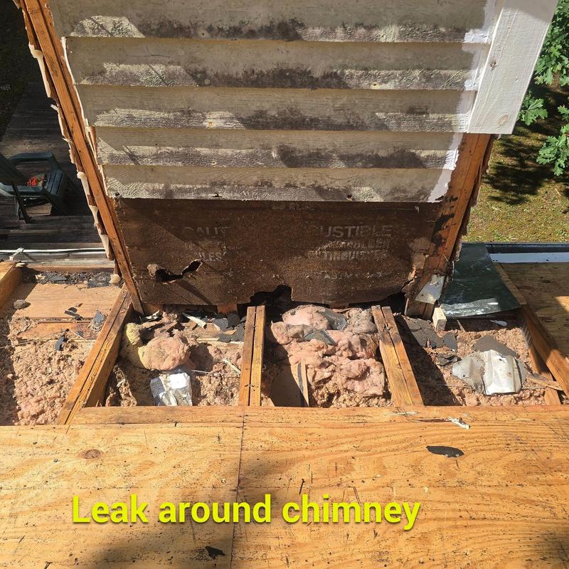 Chimney flashing leak with damaged decking and insulation Chimney flashing leak with damaged decking and insulation