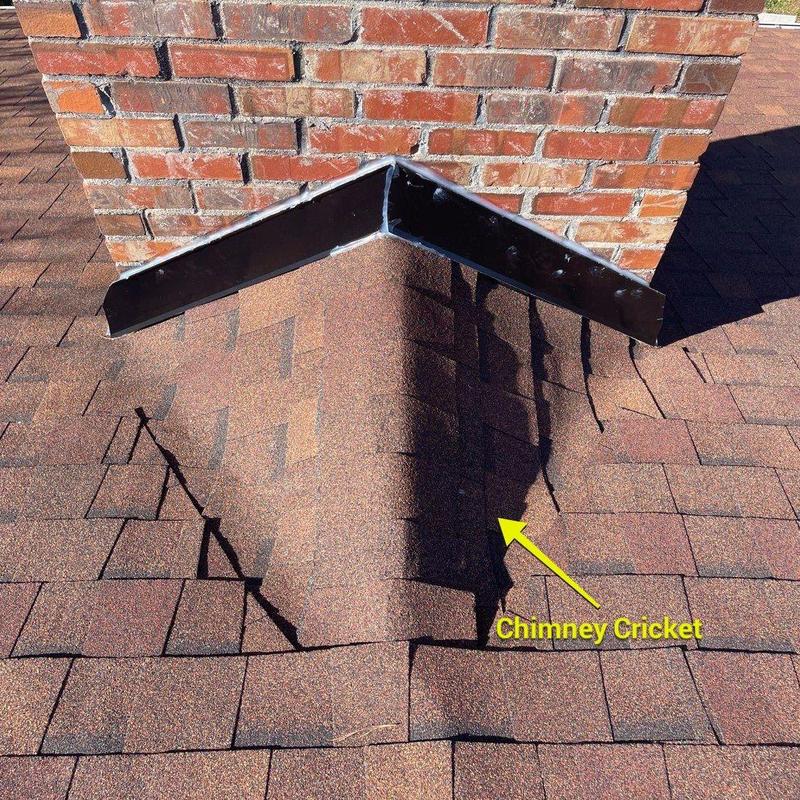 Chimney cricket with new flashing on shingle roof Chimney cricket with new flashing on shingle roof