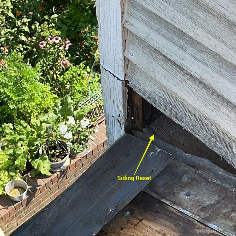 Vinyl siding corner reset with underlying wood shown Vinyl siding corner reset with underlying wood shown