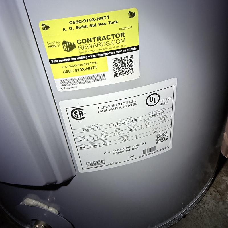 Electric storage tank water heater label close-up