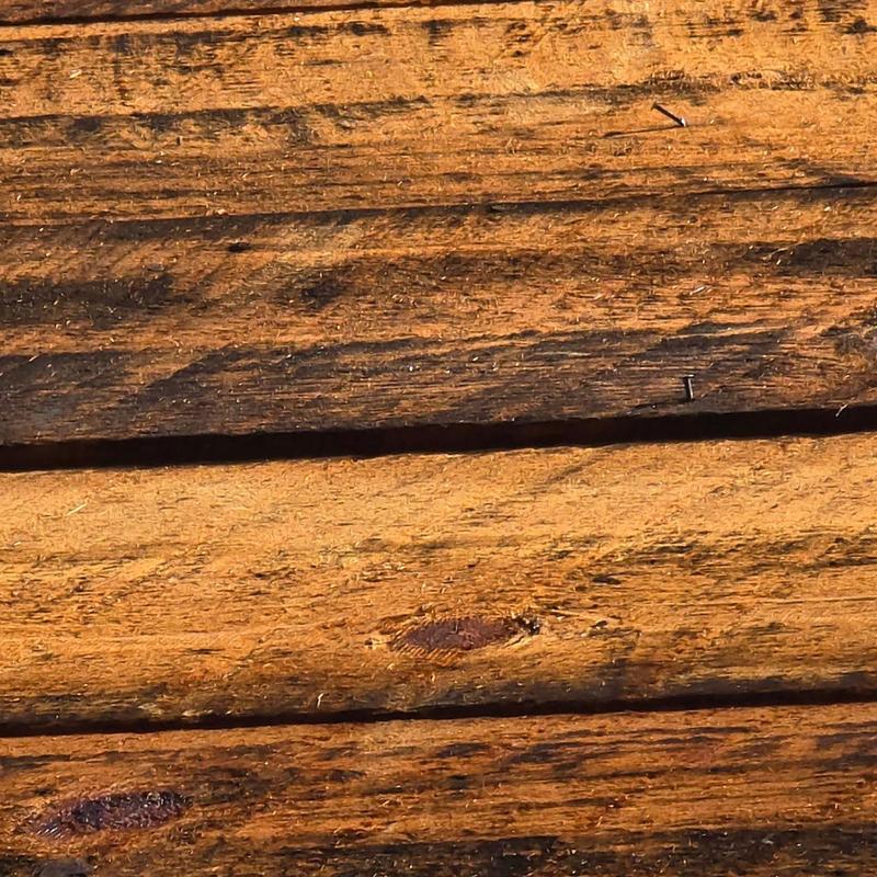 Wooden deck boards close-up showing grain and nails